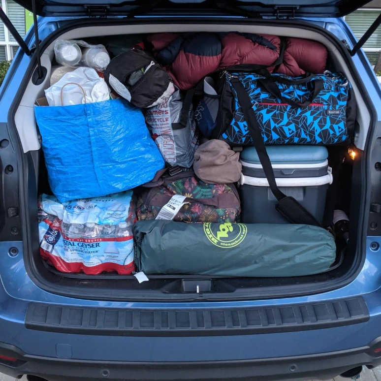 Messy car packed for camping